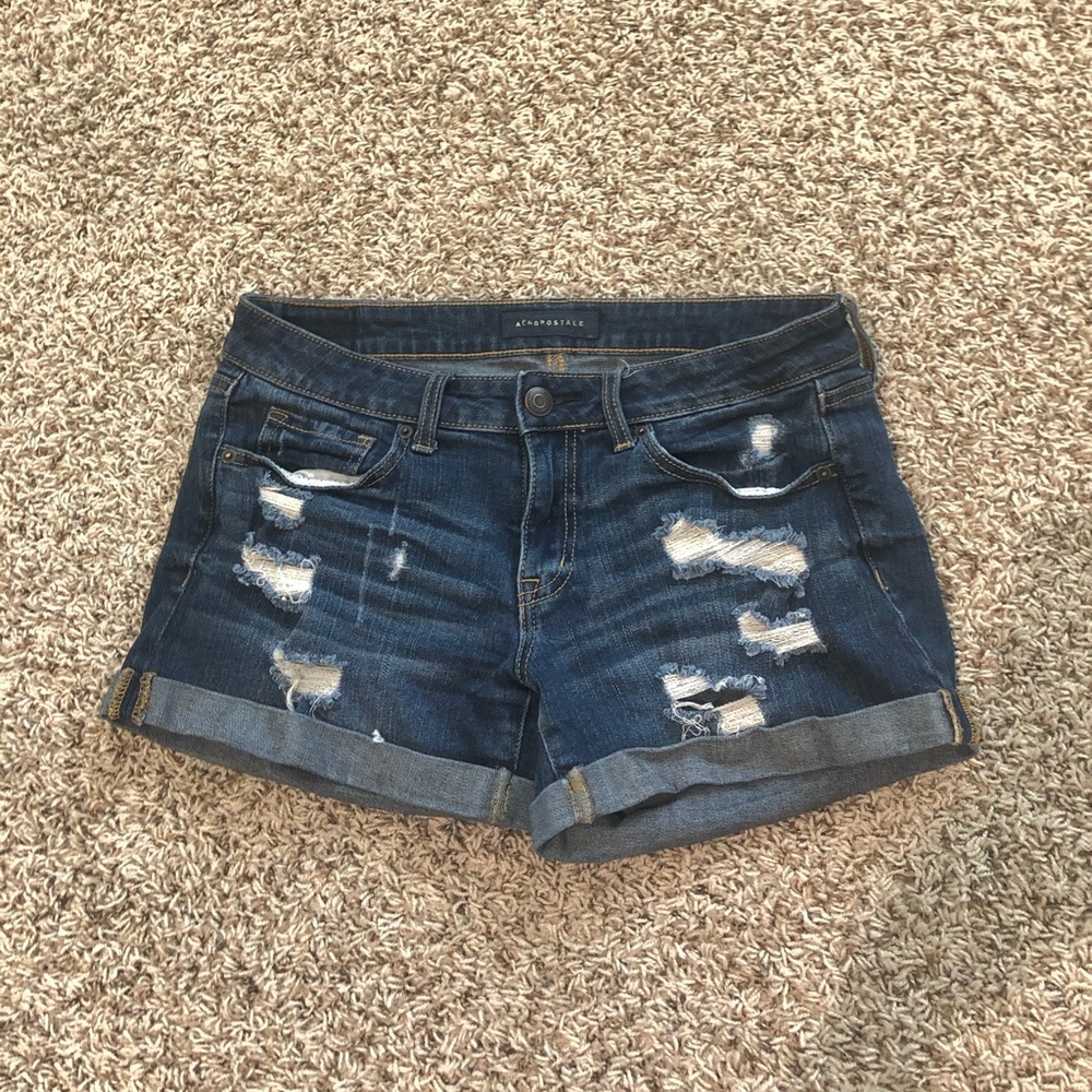 Jean shorts with rips.